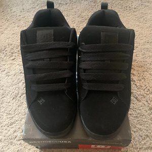 All black DC skate shoes